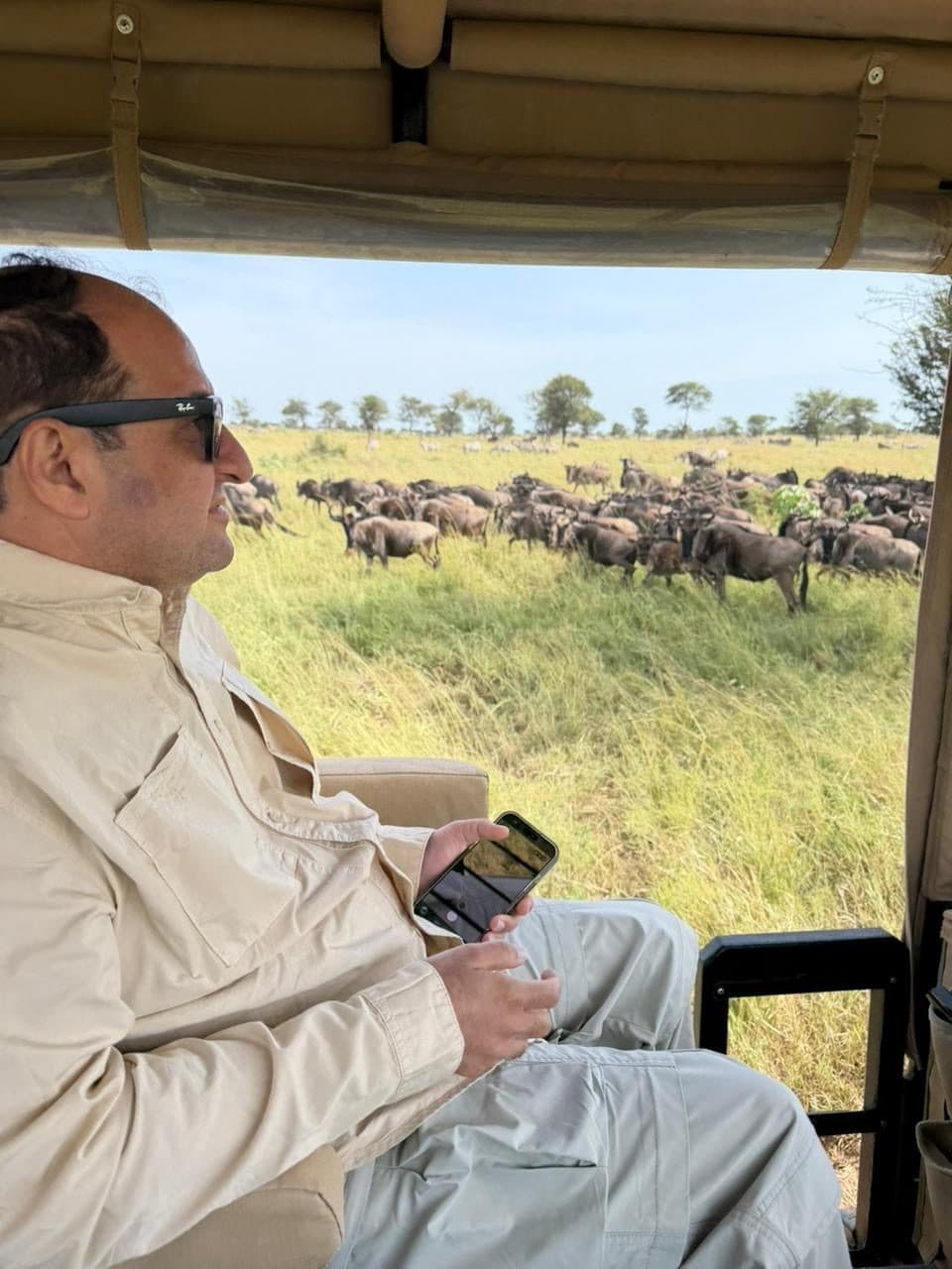 A photograph sent in by Malcolm Dadina, watching the herds from a safari vehicle